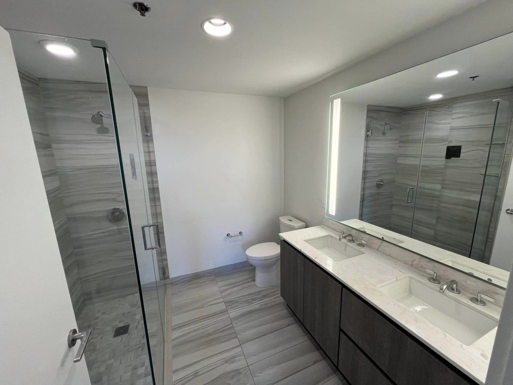 Master bathroom remodeling with vanity has 2 sinks and Corner Shower Enclosure